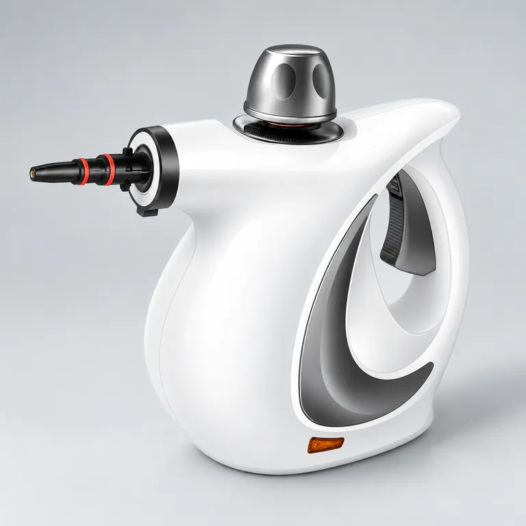 White handheld steam cleaner with grey handle panel, metallic safety cap and black nozzle with red rings on a light-grey surface